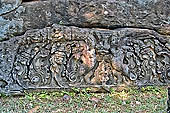 Bakong temple - remain of sculpted lintel on ground.